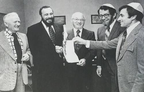 Rabbi Posner and Congregants burning the mortgage. L-R, William Schlanger, Rabbi Zalman Posner, Harry Stern, Ben Walter, Gene Heller
